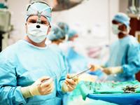 [Photo of Surgeon]